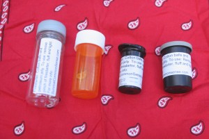 (From left) A Red Bull energy shot bottle; prescription bottle; diabetic test strip container and a 35mm film container all make good, FREE firestarter containers. (Pantenburg photos)