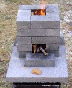 A properly- constructed rocket stove will produce an efficient cooking flame, using a fraction of the fuel of a regular campfire.