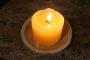 A single candle may provide enough lighting in some power outage situations.