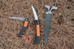 I prefer a quality saw over a hatchet in most survival situations. Here are three different types of saws I carry as the need dictates: From left, is a Gerber folder; a Fiskar sliding blade, and a double-edged Pac-Saw Wyo.