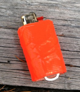 This tricked-out Bic has a pop top attached, and is wrapped with about five feet of duct tape.