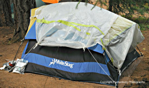 A tarp or piece of plastic can improve a tent's efficiency and keep the rain out.