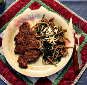 Dinner is served: T-bone steaks, nettles and pasta.