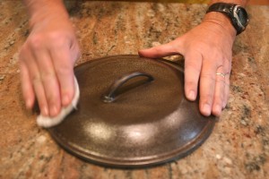 When the cast iron is clean and polished, coat the surface with shortening. Only use enough to make the cast iron look wet.