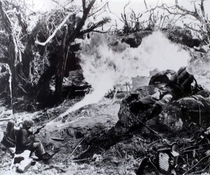 A Marine from 1st Marine Division uses a flamethrower to clear a path through what was once a thick jungle in Tarawa - 1943 (National Archives, Marine Corps)