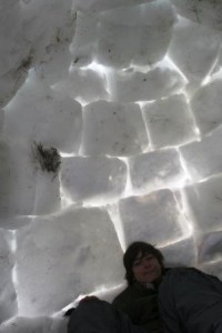 Igloo interior during winter camping outing.